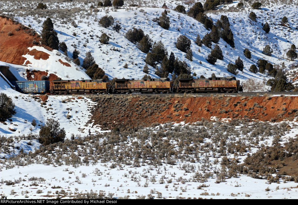 UP 5628, 5663, 8025 (C44ACCTE, C44ACCTE, C45ACCTE) lead an eastbound manifest exiting a small tunnel at Castle Rock, Utah. February 19, 2022 {Winter Echofest}
